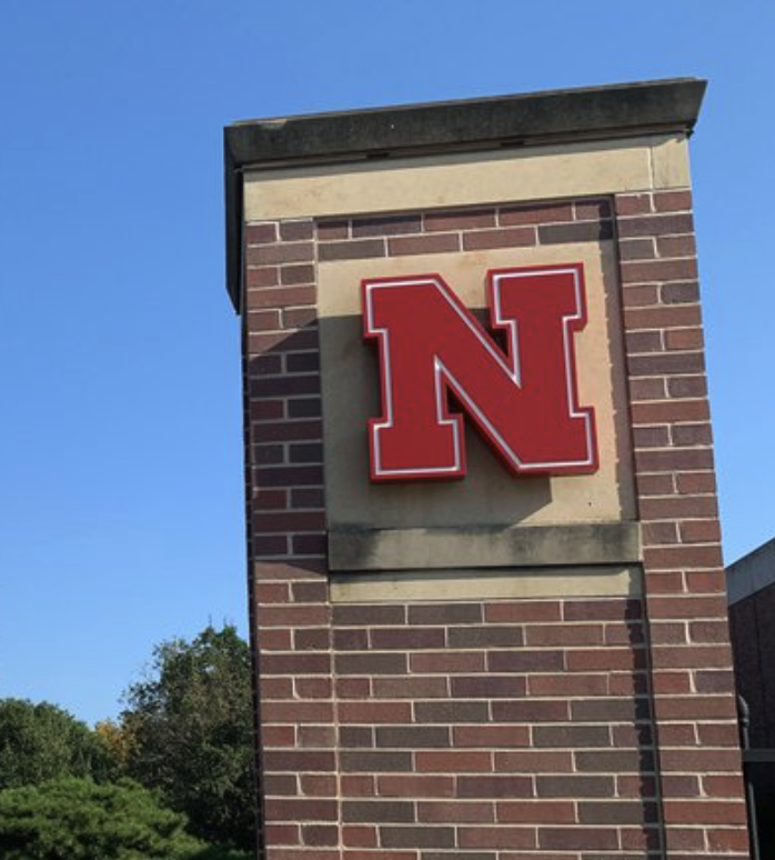 A brick column with the Nebraska N